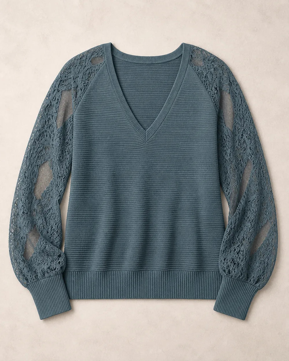 Women's Storm Blue ribbed V-neck sweater with floral lace sleeves, flat-lay view.